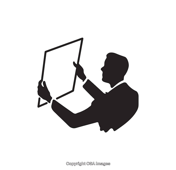 Silhouette of Individual Inspecting a Framed Object with Focused Attention