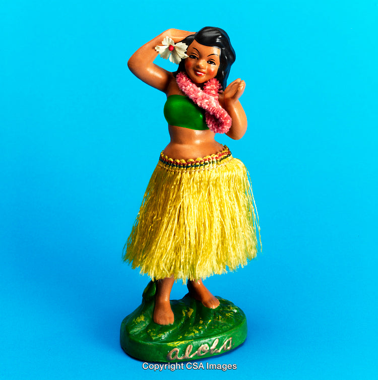 Hula Girl Figurine Displayed Against Bright Blue Background
