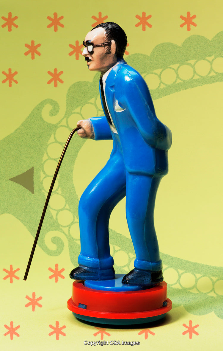 Colorful Retro Toy Figure of a Man with a Walking Cane
