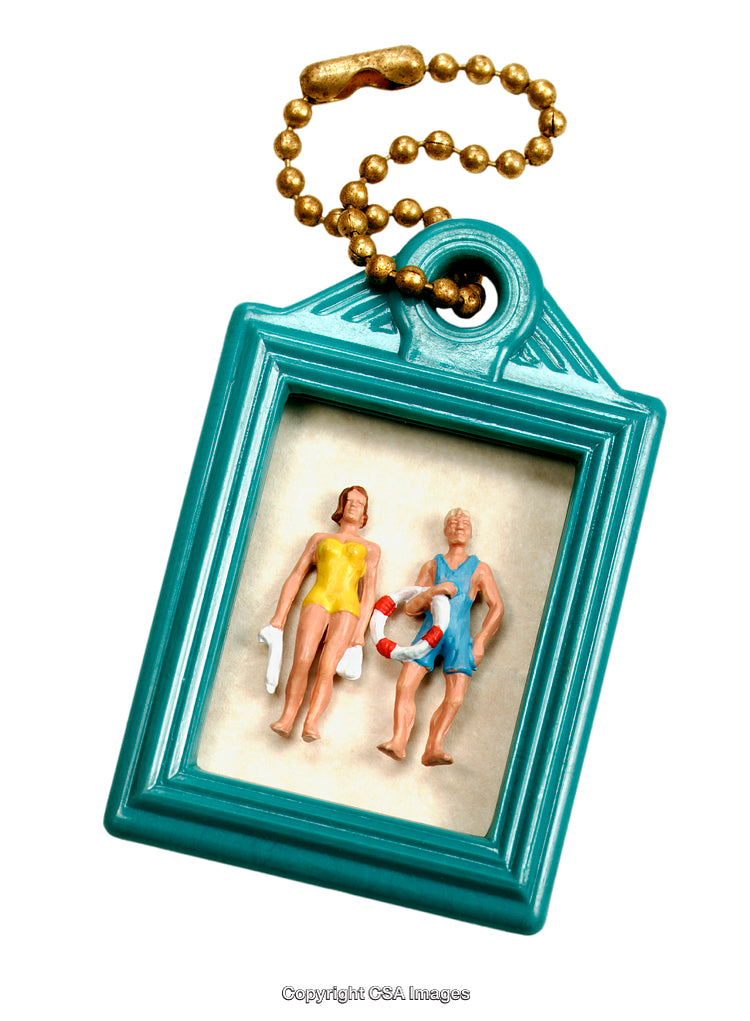 Vintage Toy Keychain Featuring Miniature Figures in Plastic Display