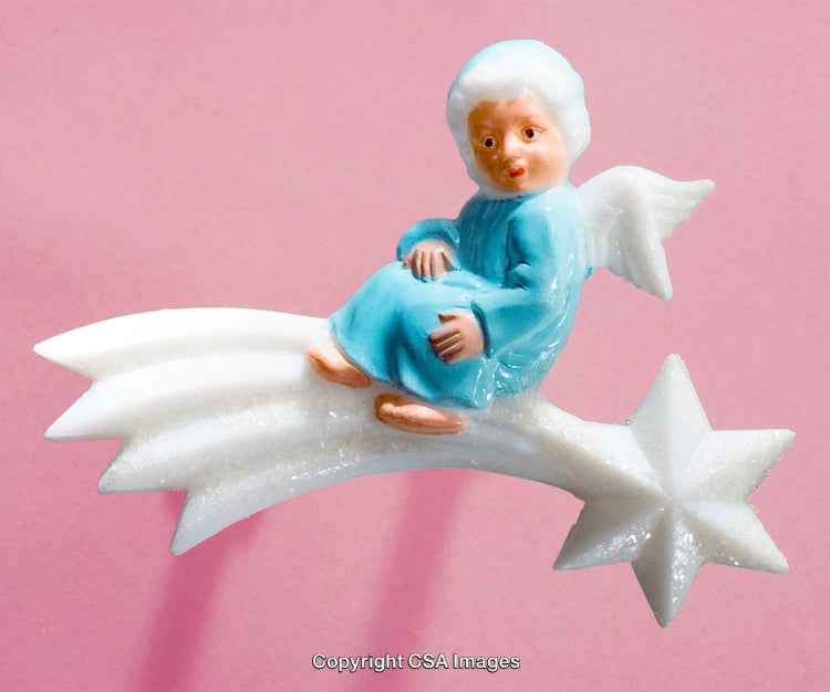 Blue Angel Figurine Sitting on a Shooting Star with Pink Background