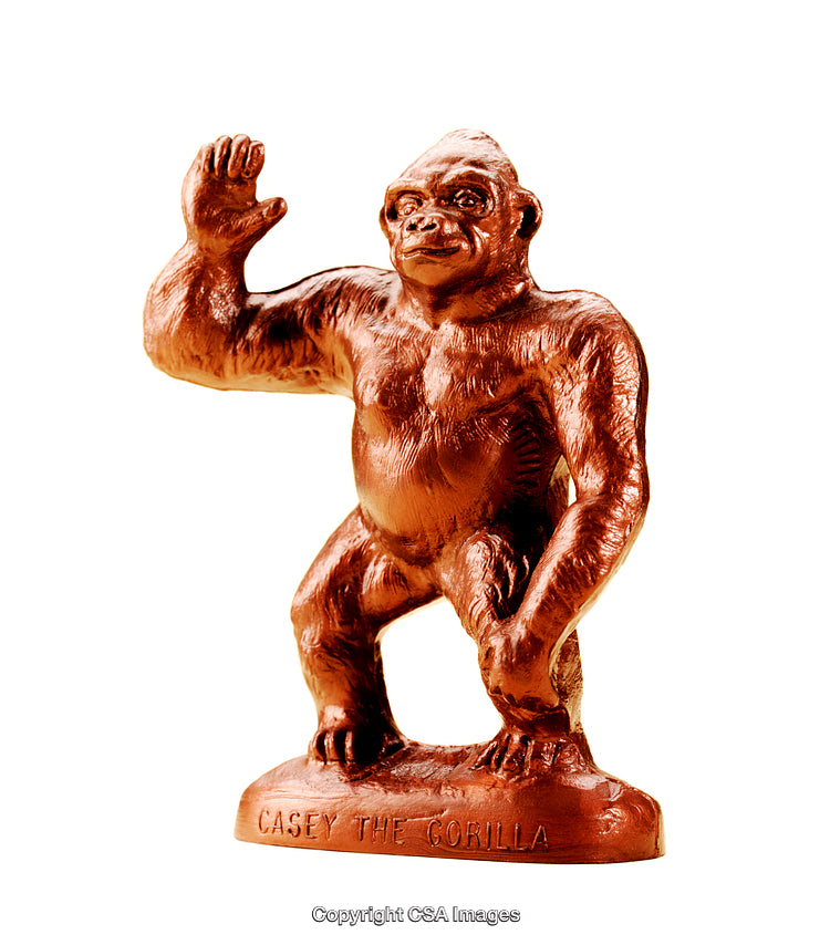 Orange Gorilla Figurine Featuring Raised Arm and Detailed Textured Surface