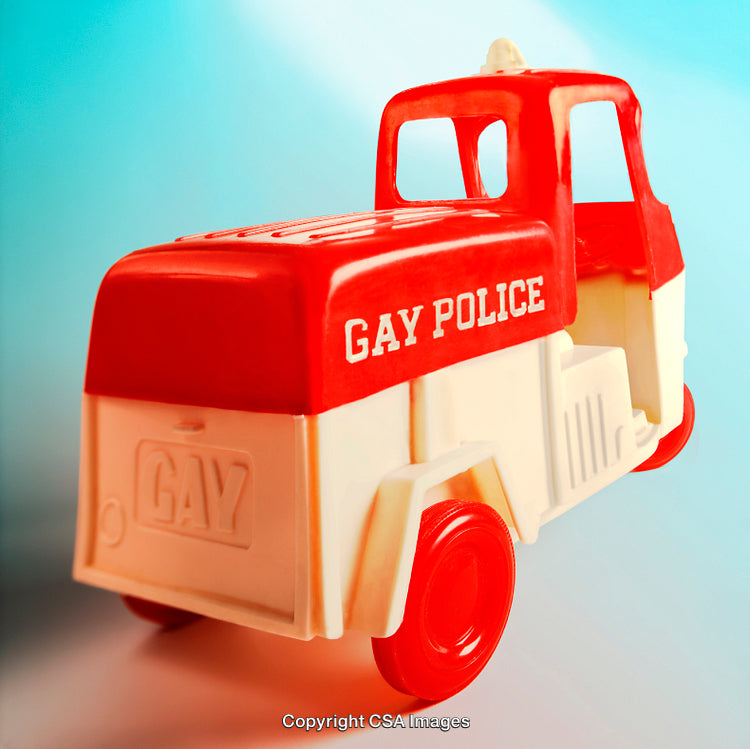 Red and White Toy Vehicle Featuring Humorous Design on Gradient Background