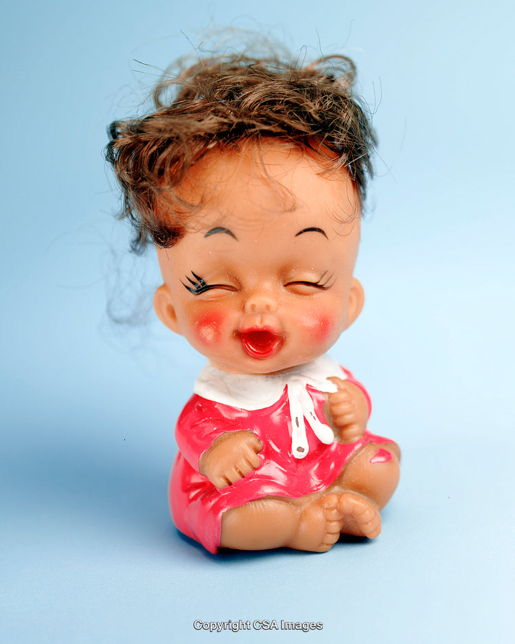 Cute Vintage Doll Figurine on Pastel Blue Background