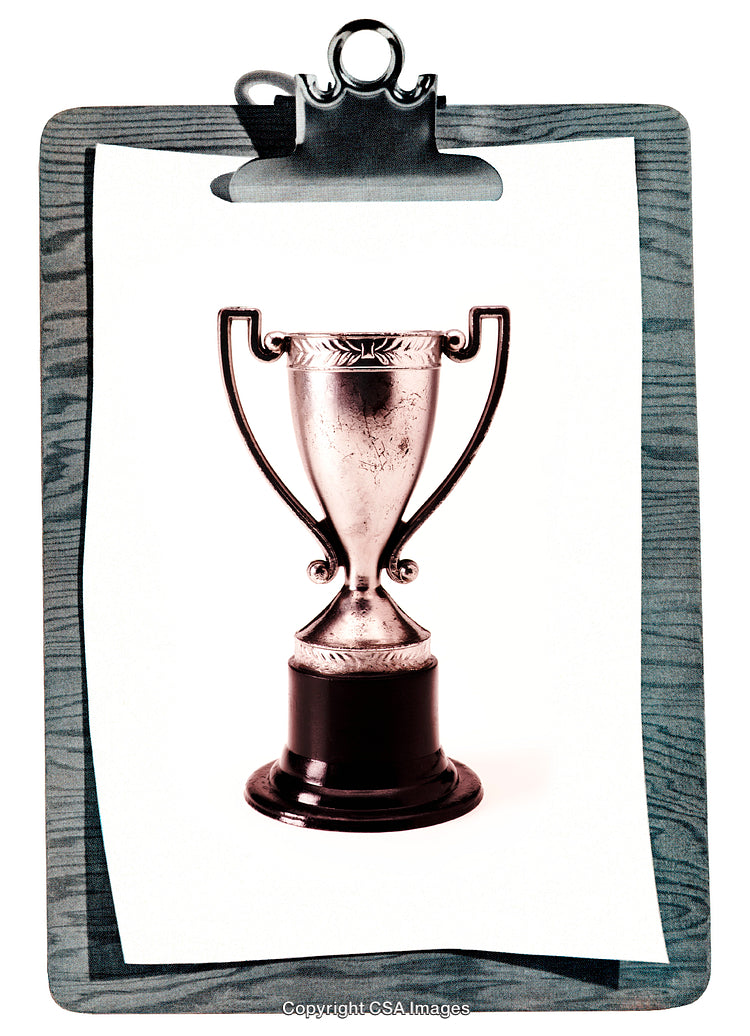 Silver Trophy Displayed on a Clipboard With a Wooden Textured Border