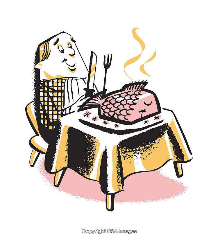 Man Dining With a Whole Cooked Fish at a Table