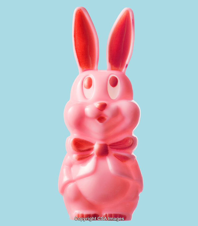 Pink Bunny Figurine on Light Blue Background