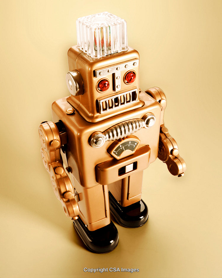 Vintage Gold Toy Robot Against Neutral Background
