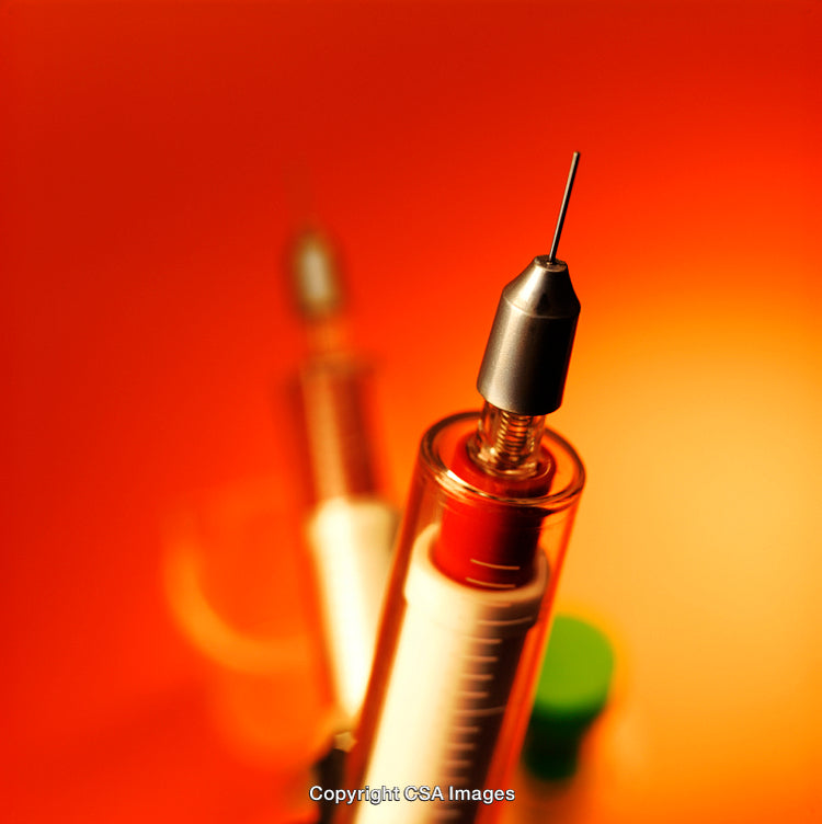Syringe with Needle on Orange Background Capturing Medical and Health Concepts