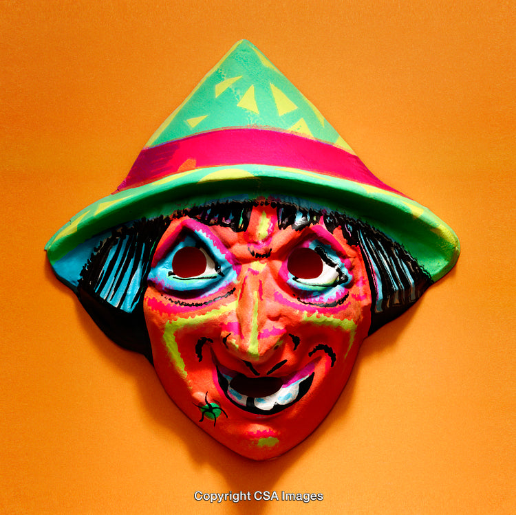 Colorful Carnival Mask With Bright Hat Against an Orange Background