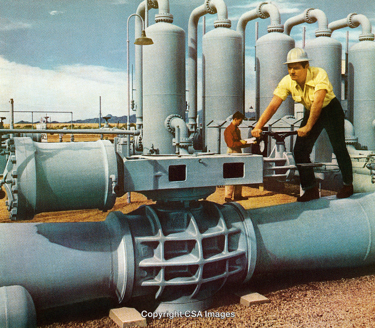 Industrial Workers Adjust Valves and Inspect Equipment in Petroleum Facility