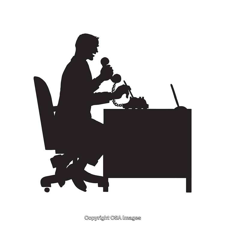 Silhouette of a Busy Office Worker at a Desk with Telephones