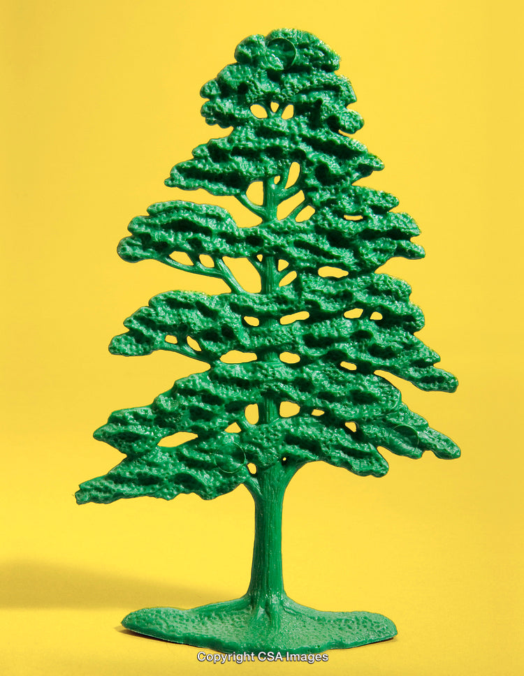 Green Plastic Toy Tree Against Vibrant Yellow Background