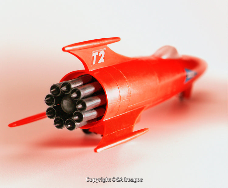 Bright Red Toy Rocketship with Engines Displayed Up Close