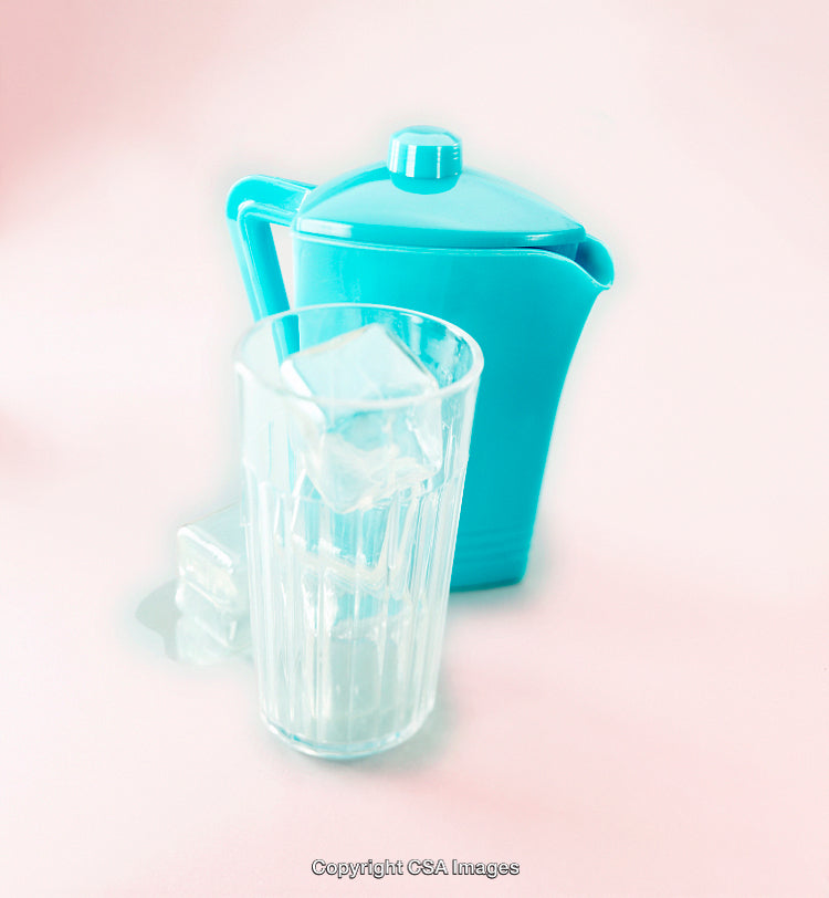 Plastic Toy Pitcher and Glass Set with Ice Cubes on Pastel Surface