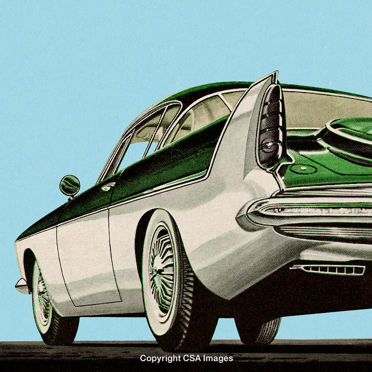 Vintage Green Classic Car with an Iconic 1960s Design on Light Sky Background
