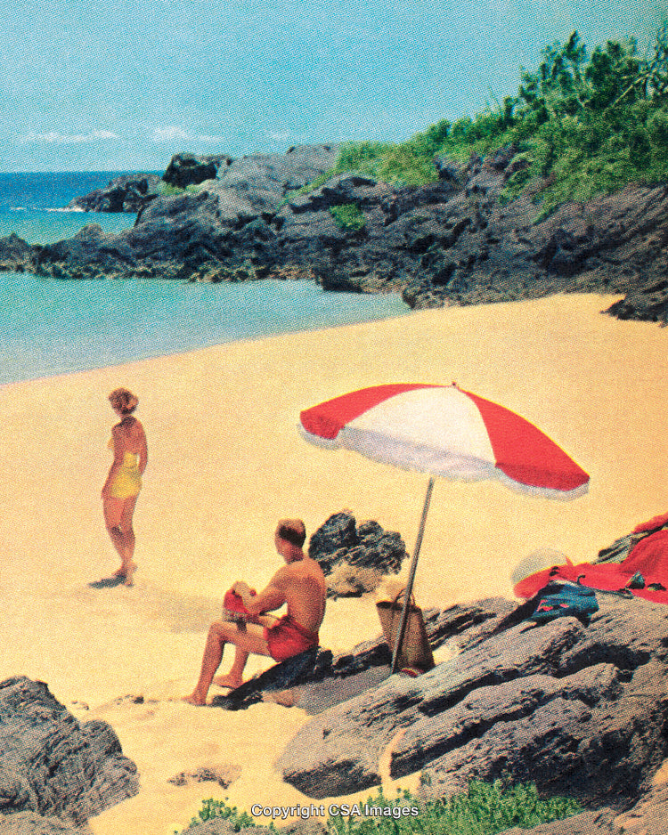 Serene Beach Scene with Umbrella and People by Rocky Coastline