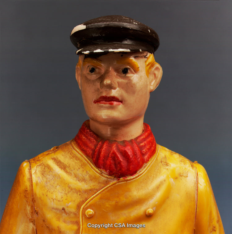 Vintage Plastic Toy Soldier Figure with Weathered Surface and Bright Uniform