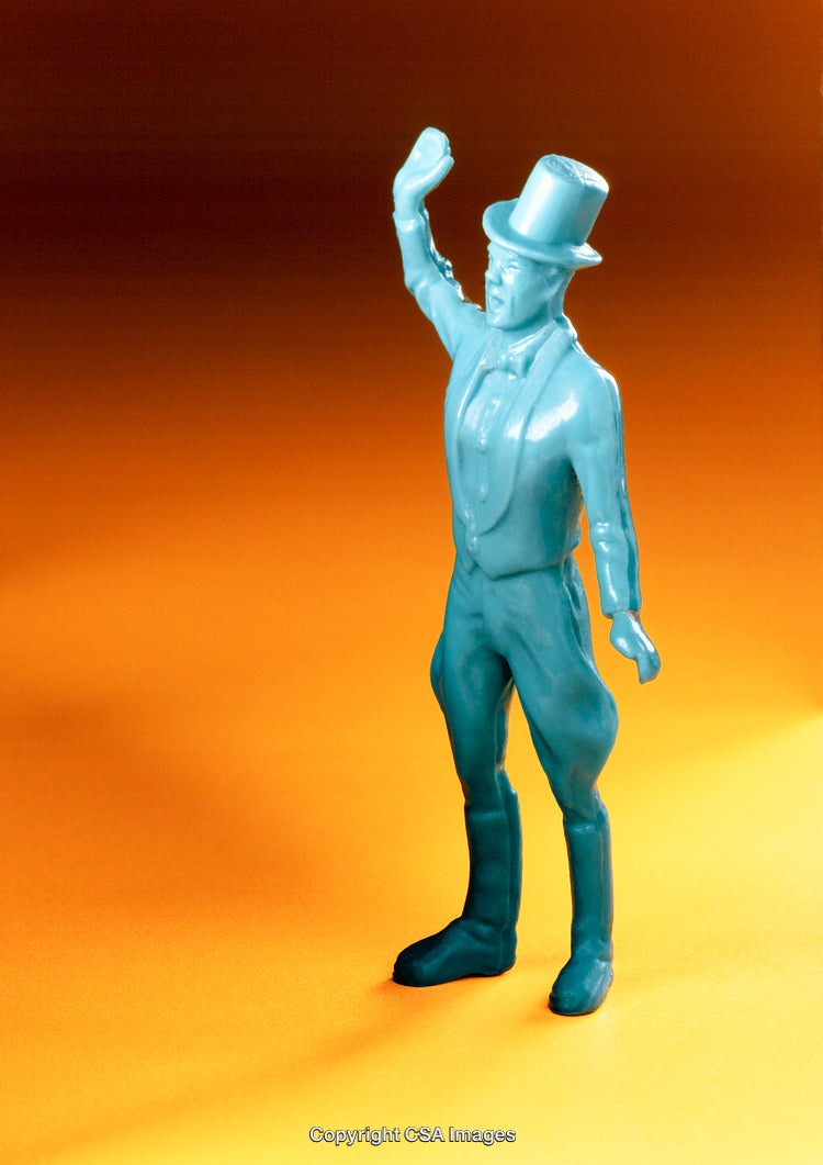 Blue Plastic Figurine of Man Waving Against Orange Background