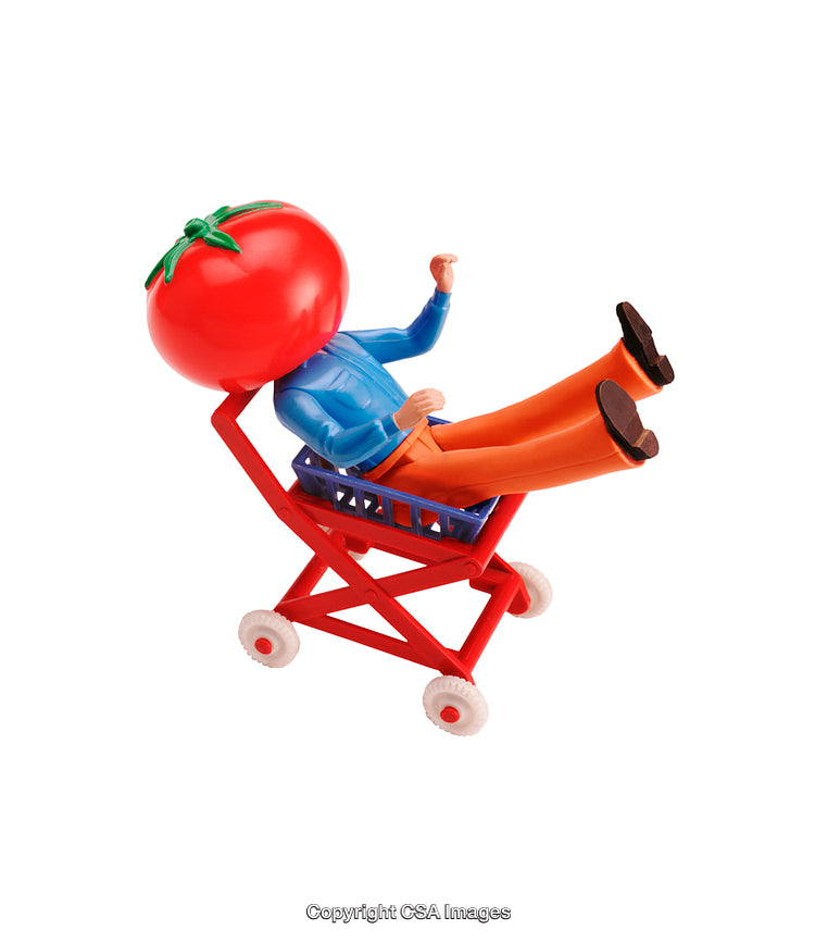 Whimsical Toy Figurine with Tomato Head Sitting in Red Toy Trolley