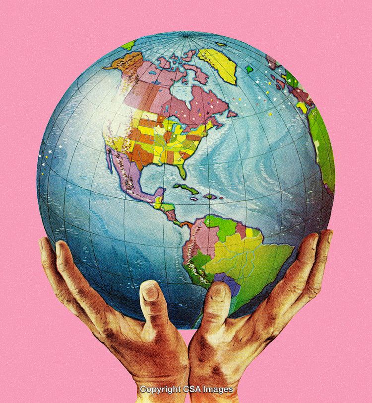 Hands Holding a Colorful Globe on a Vibrant Pink Background