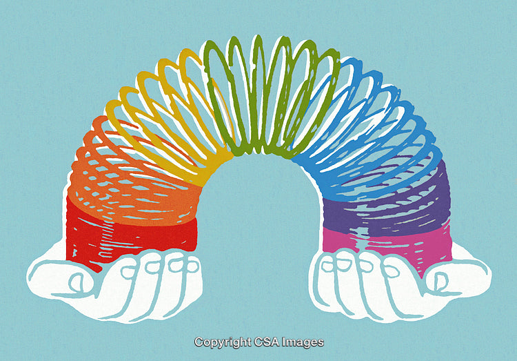 Colorful Rainbow Spring Toy Held Gently by Open Hands on Blue Background