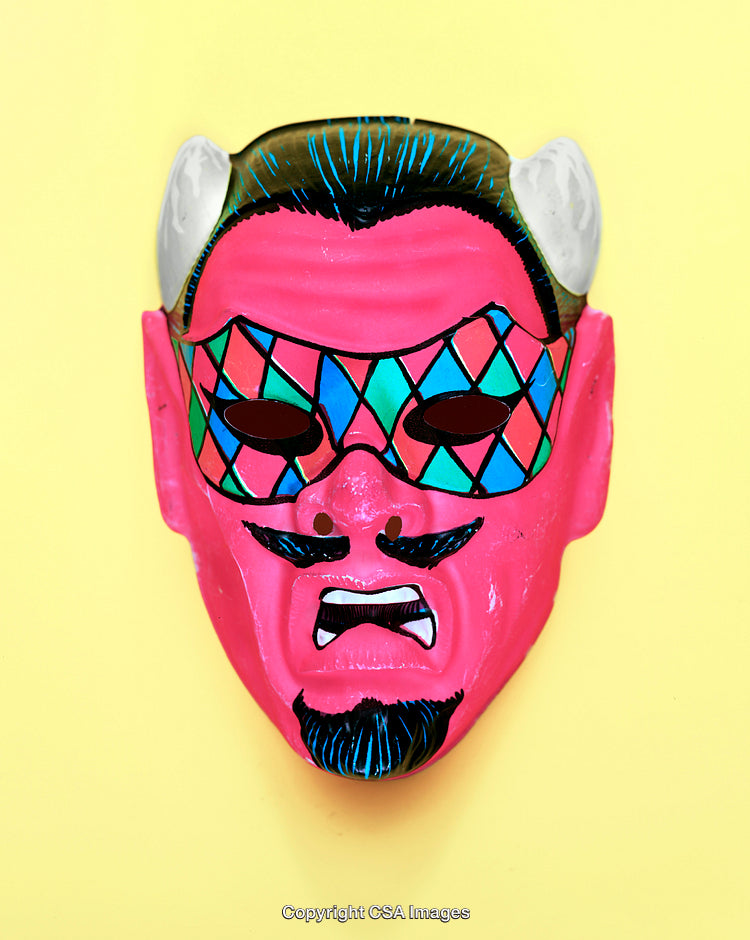 Colorful Demon Mask With Geometric Patterns on Yellow Background