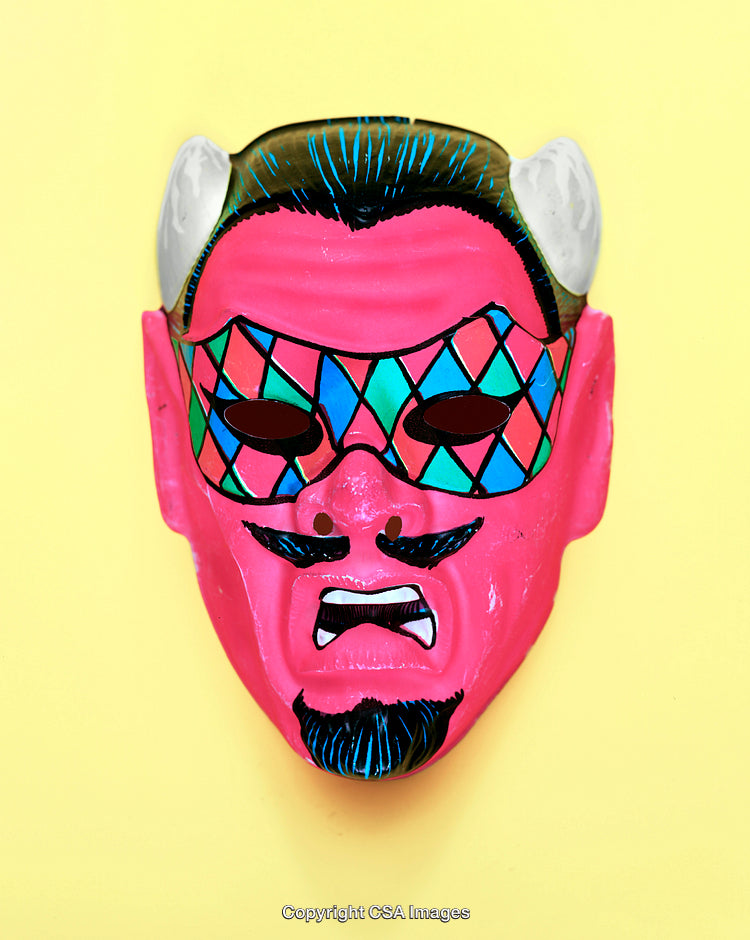 Colorful Demon Mask With Geometric Patterns on Yellow Background