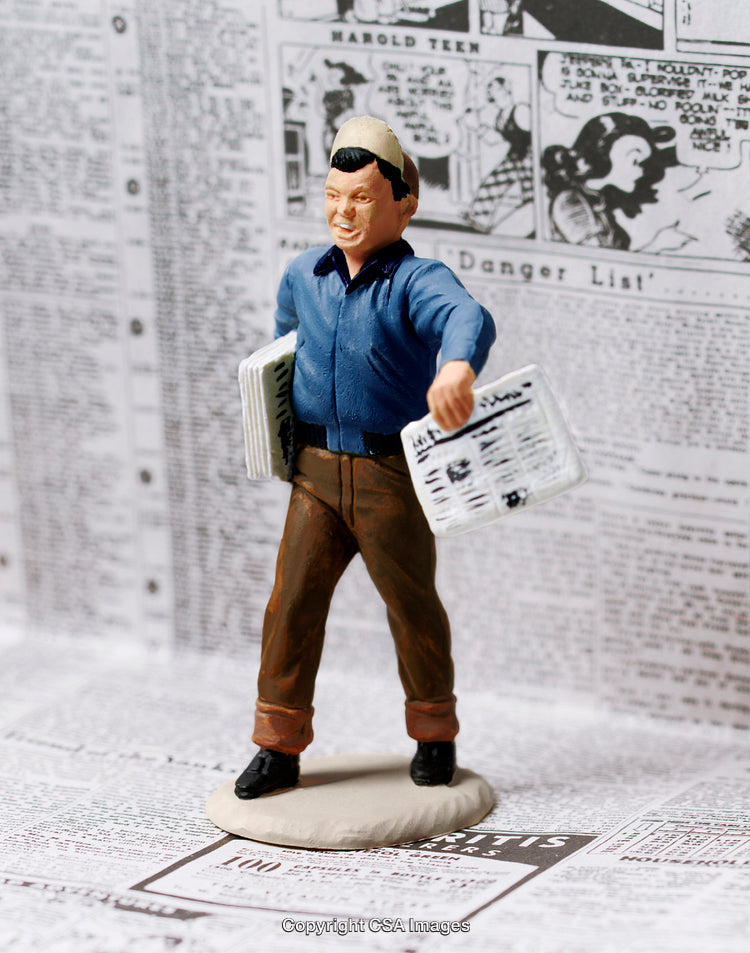 Miniature Newsboy Figure Holding Newspapers on a Vintage Comic Background