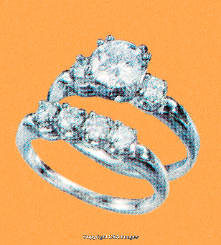 Elegant Diamond Rings Against Vibrant Orange Background for Jewelry Display
