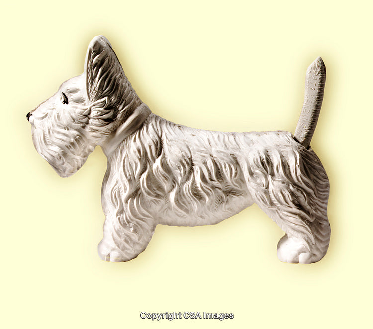 White Terrier Dog Figurine Against Yellow Background
