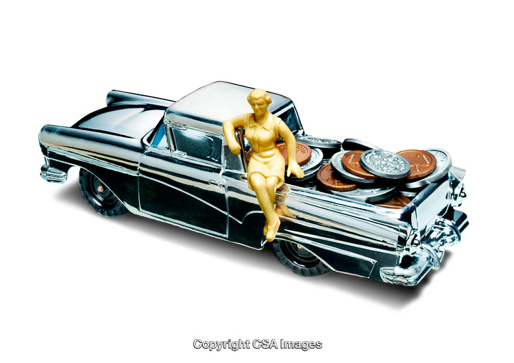 Retro Toy Truck Carrying Coins with a Figurine Sitting on It