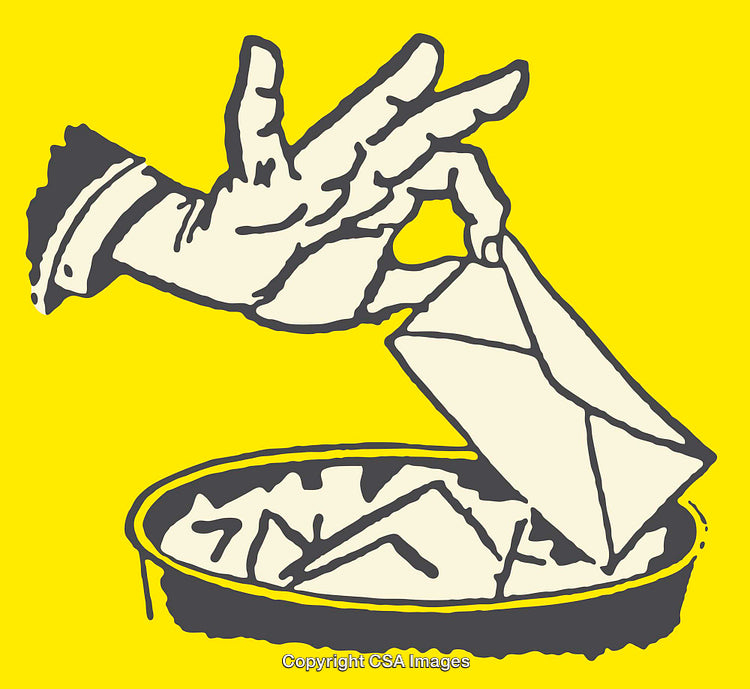 Hand Placing an Envelope Into a Receptacle on Yellow Background