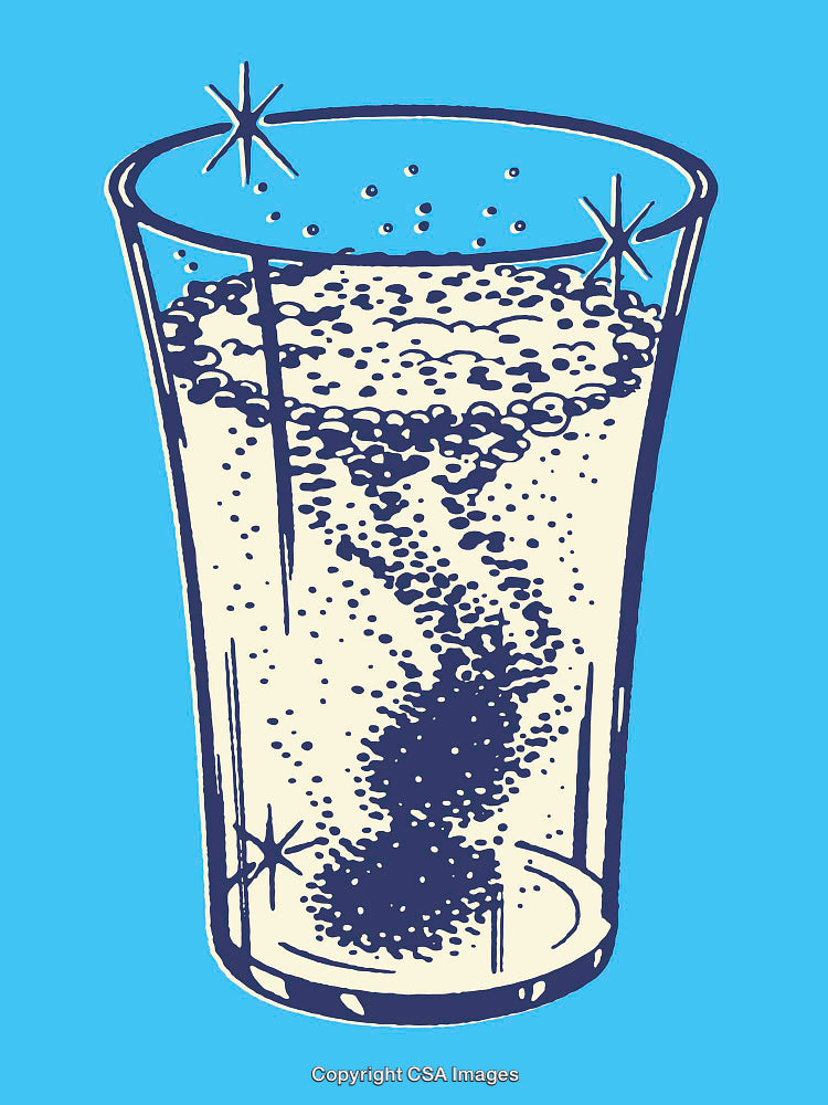 Glass of Sparkling Water with Effervescent Bubbles on Blue Background