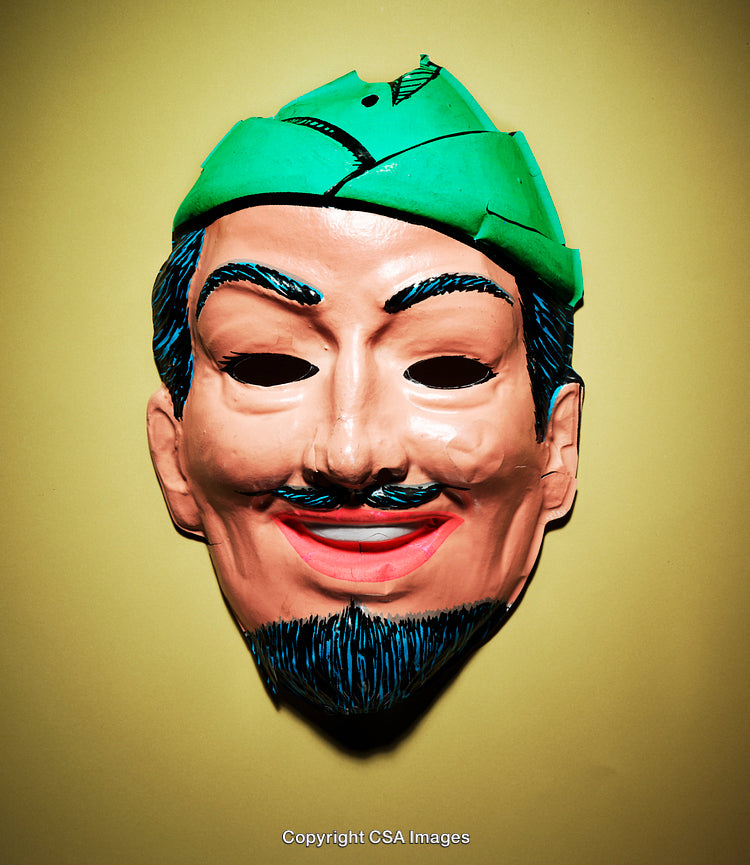 Vibrant Plastic Mask on Yellow Background with Carved Decorative Features