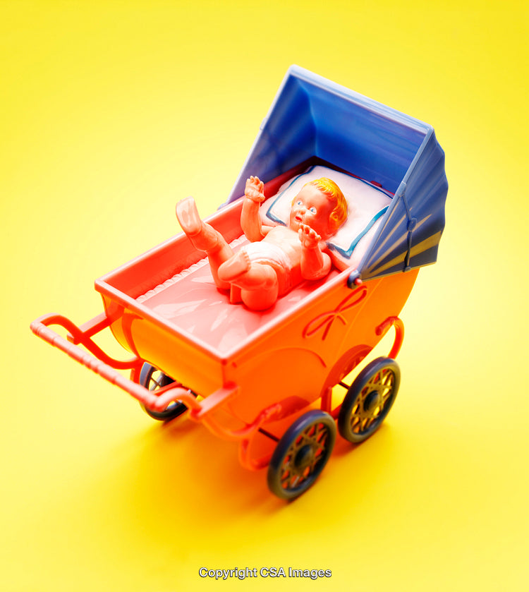 Colorful Toy Baby in Orange Stroller on Bright Yellow Background