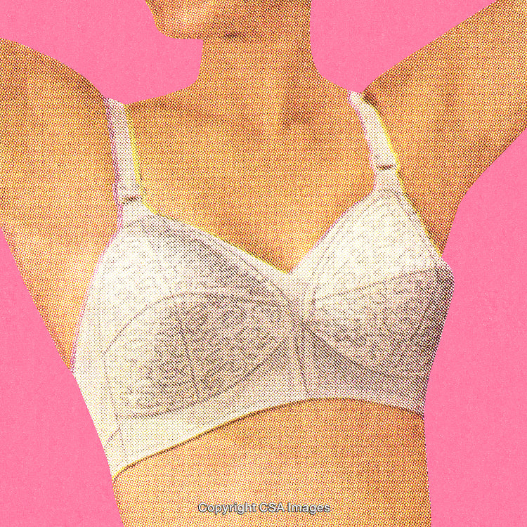 Retro Styled Closeup of Woman Wearing a Bra Against Pink Background