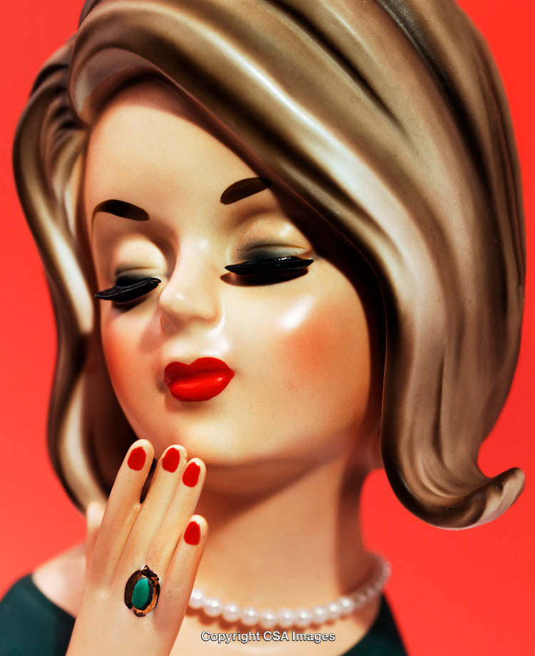 Elegant Vintage Figurine of a Glamorous Woman with Pearl Necklace and Stylish Hair