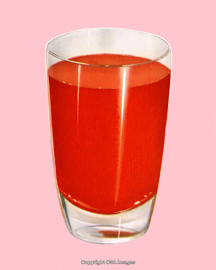 Glass of Refreshing Red Juice on a Pink Background