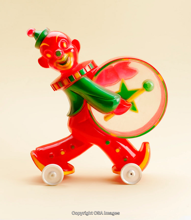Colorful Vintage Toy Clown With Drum on Wheels