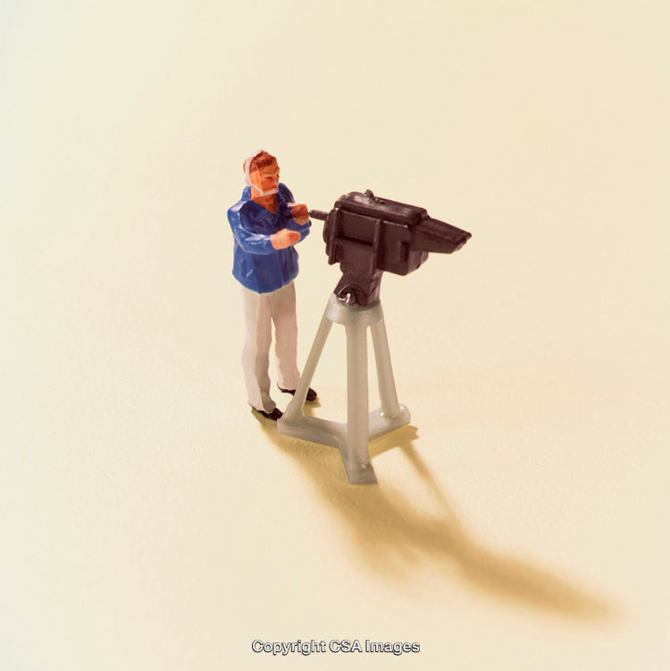 Miniature Cameraman Figurine at Work with Tripod and Camera