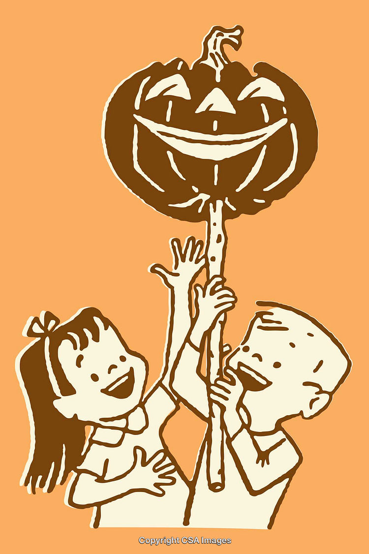 Children Joyfully Holding a Pumpkin Decorated for Halloween Celebration