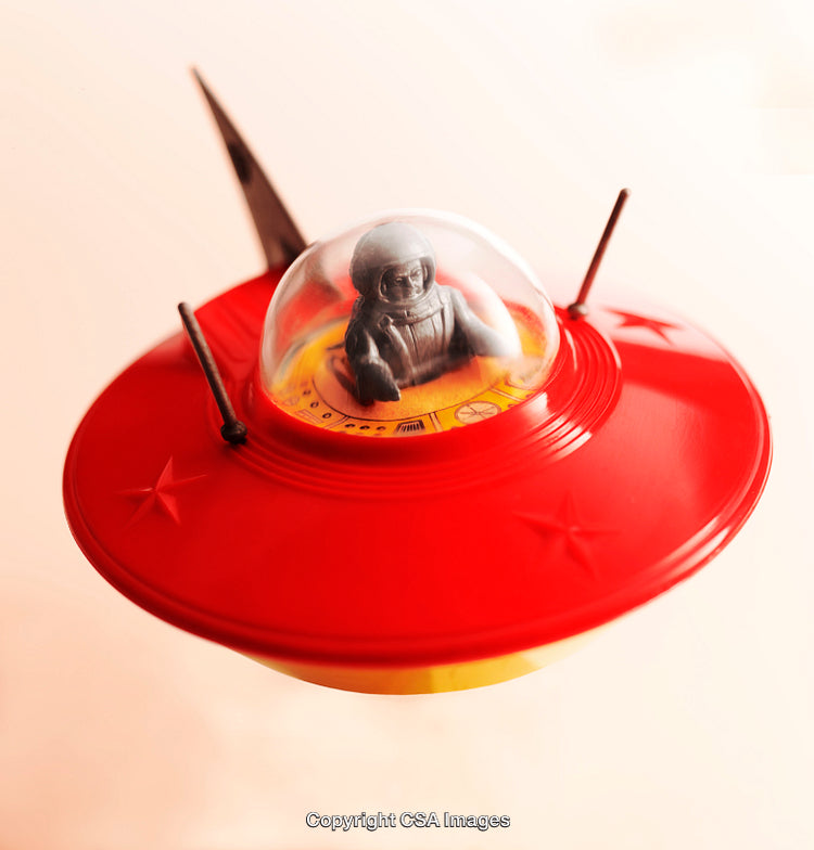 Red Retro Spaceship With Astronaut Figure Inside Transparent Dome