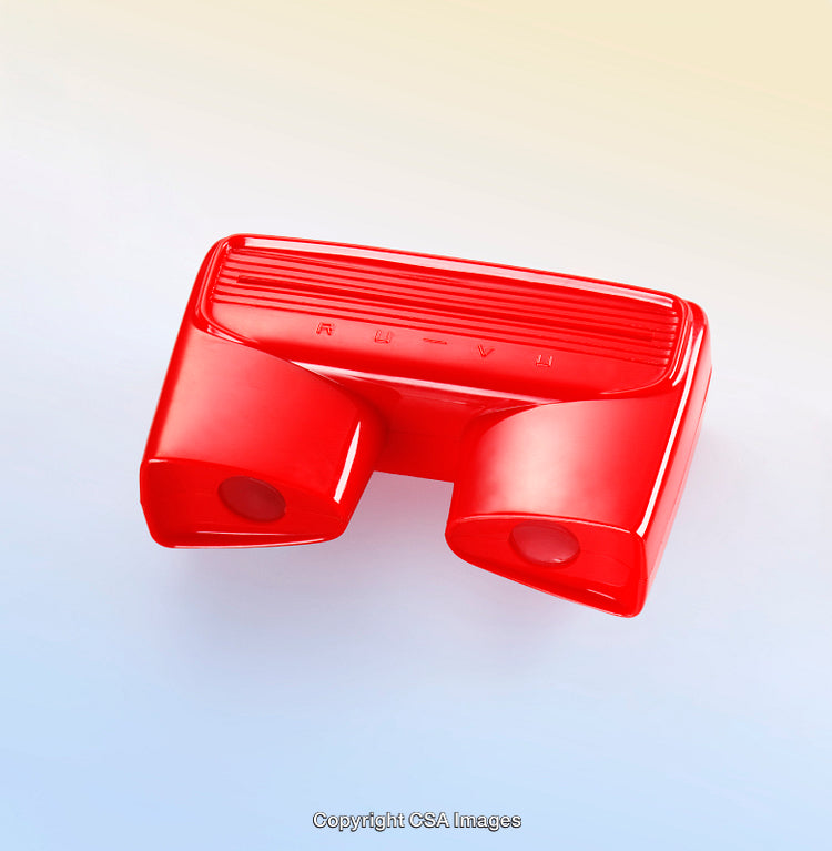 Red Plastic Toy Viewer Against Gradient Background for Vintage Nostalgia