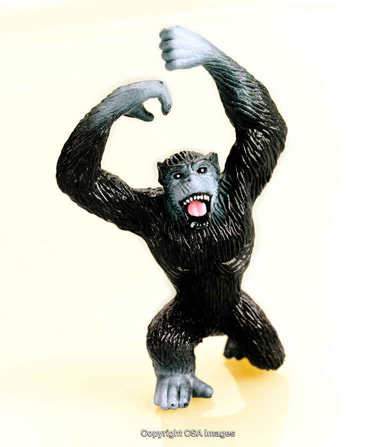 Dynamic Plastic Gorilla Toy Posing Against a Bright Background
