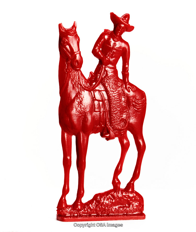 Red Plastic Cowboy Toy Riding a Horse in Detailed Iconic Pose