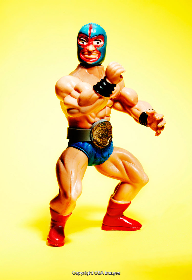 Colorful Plastic Wrestler Action Figure on Vibrant Yellow Background