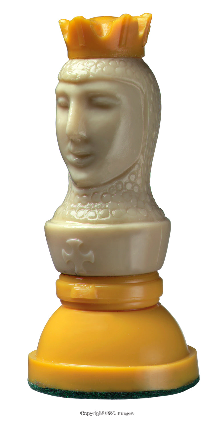 Close-Up of Yellow and White Chess King Figure With Crown
