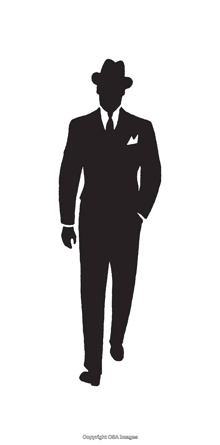 Silhouette of a Businessman in a Suit and Hat Walking Confidently