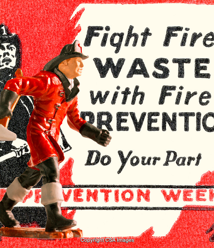 Firefighter Toy Figure in Front of Fire Prevention Campaign Poster Display